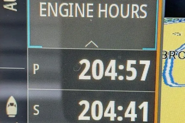 Slide: The Image of Engine hours display on 2024 Axopar 37 XC Cross Cabin, showing 204:57 and 204:41. - 45