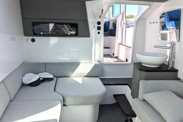Slide: The Image of 2024 Axopar 37 XC Cross Cabin interior with modern seating and sleek design. - 47