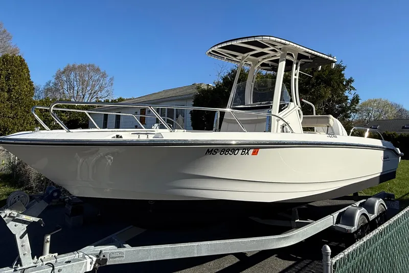 Slide: The Image of 2023 Boston Whaler 220 Dauntless boat interior with seating and stainless steel railings. - 10