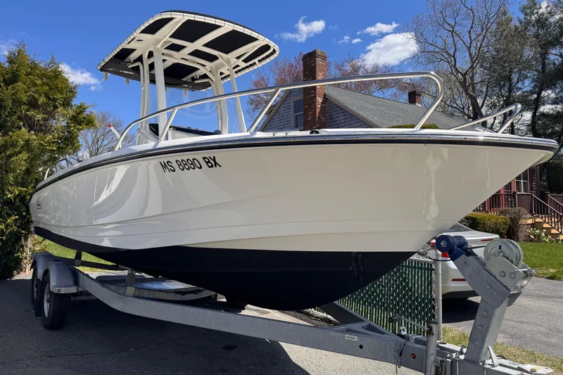 Slide: The Image of Manufacturer Provided Image: 2023 Boston Whaler 220 Dauntless boat interior with cushioned seating. - 11