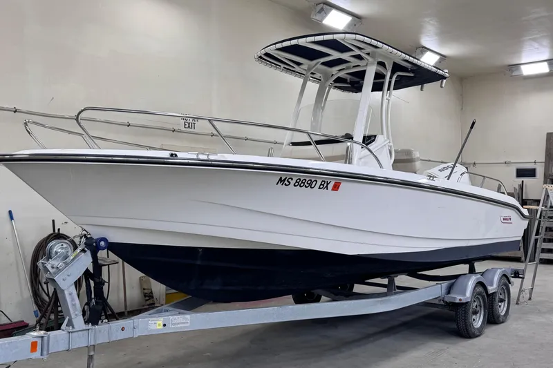 Slide: The Image of Manufacturer Provided Image: 2023 Boston Whaler 220 Dauntless boat storage compartment open. - 12