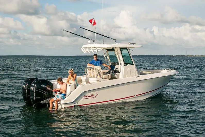 Slide: The Image of Manufacturer Provided Image: 2025 Boston Whaler 250 Outrage boat on open water with passengers enjoying the ride. - 10