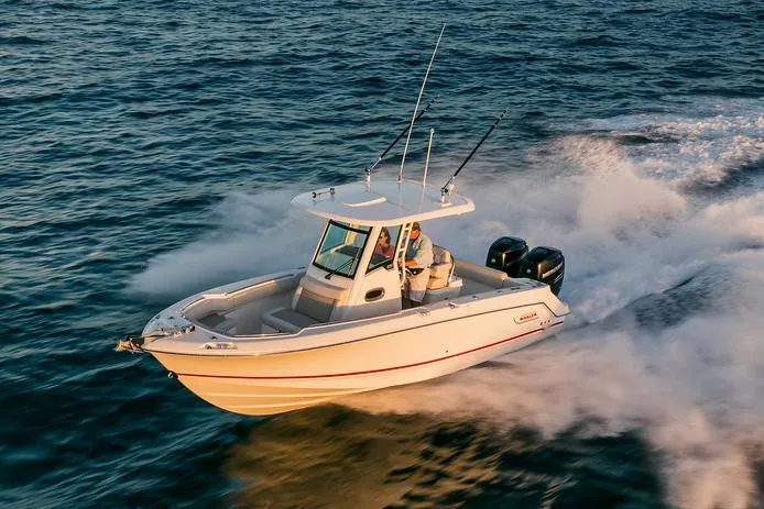 Slide: The Image of Manufacturer Provided Image: 2025 Boston Whaler 250 Outrage speeding on open water. - 3