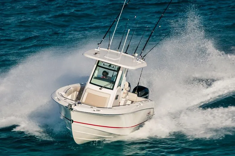 Slide: The Image of Manufacturer Provided Image: 2025 Boston Whaler 250 Outrage speeding on ocean waters. - 4