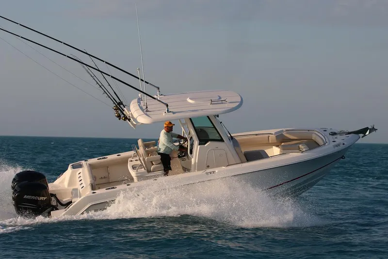Slide: The Image of Manufacturer Provided Image: 2025 Boston Whaler 250 Outrage cruising on open water, showcasing speed and performance. - 7