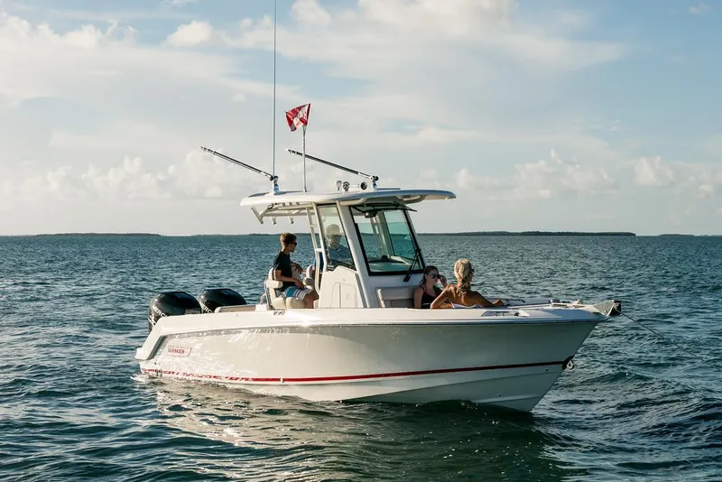 Slide: The Image of Manufacturer Provided Image: 2025 Boston Whaler 250 Outrage boat cruising on open water under a clear sky. - 8
