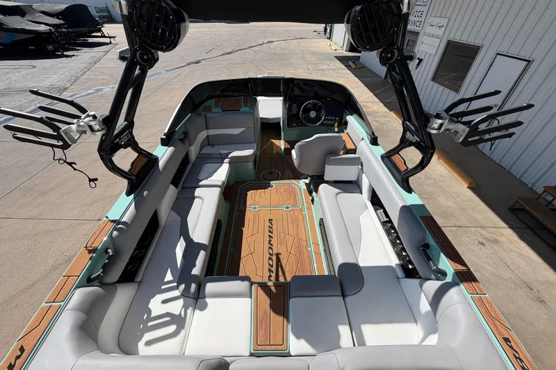 Slide: The Image of 2025 Moomba Mojo boat interior with spacious seating and modern design. - 10