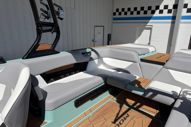 Slide: The Image of 2025 Moomba Mojo boat interior with sleek seating and modern design elements. - 14