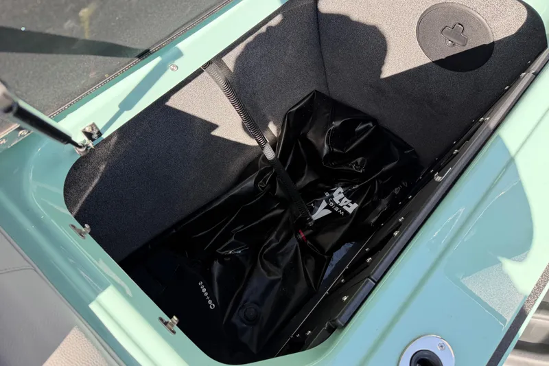 Slide: The Image of 2025 Moomba Mojo boat storage compartment with ballast bag inside. - 18