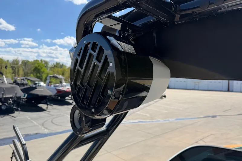 Slide: The Image of 2025 Moomba Mojo boat speaker system, outdoor setting, clear sky, showcasing modern audio equipment. - 21