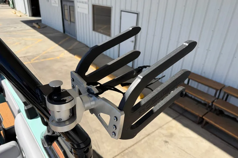 Slide: The Image of Wakeboard rack on 2025 Moomba Mojo boat, mounted securely on a metal frame. - 22