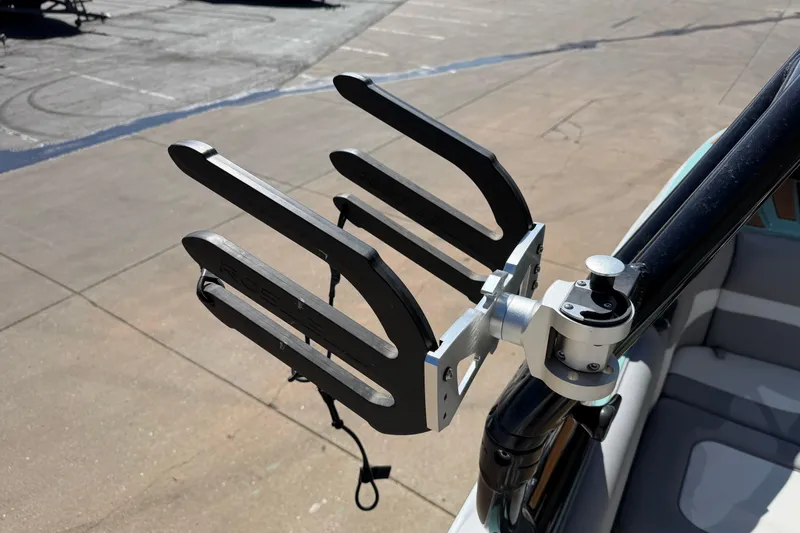 Slide: The Image of Wakeboard rack on 2025 Moomba Mojo boat, mounted on a sunny day. - 23