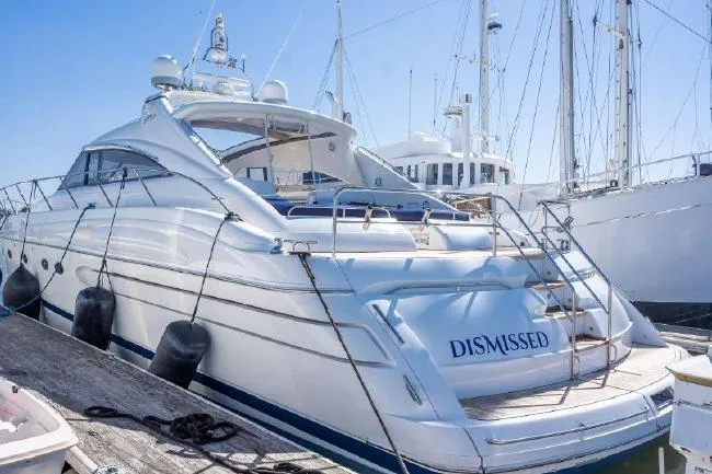 The Image of Luxury 2003 Viking Princess 65 yacht docked at marina, named "DISMISSED". - 0