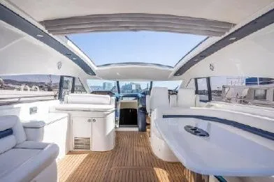 Slide: The Image of Interior view of a 2003 Viking Princess 65 yacht with sleek design and spacious seating. - 10