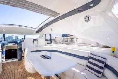 Slide: The Image of Luxurious 2003 Viking Princess 65 yacht interior with sleek seating and elegant design. - 11