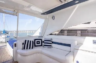 Slide: The Image of Luxurious 2003 Viking Princess 65 yacht with elegant white seating and nautical decor. - 12