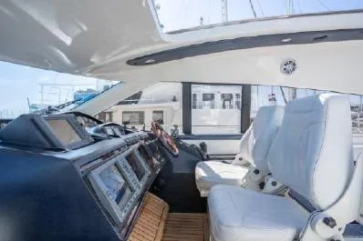 Slide: The Image of Luxurious 2003 Viking Princess 65 yacht interior with modern cockpit and plush seating. - 13