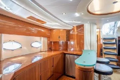 Slide: The Image of Luxurious interior of 2003 Viking Princess 65 yacht with sleek wood finishes and modern design. - 18