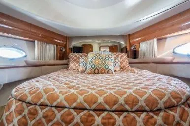 Slide: The Image of Luxurious cabin interior of 2003 Viking Princess 65 yacht with elegant bedding and wood accents. - 26