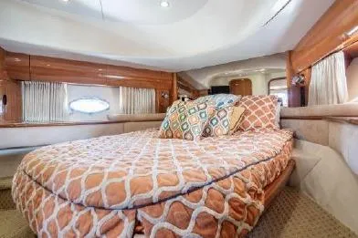 Slide: The Image of Luxurious cabin interior of 2003 Viking Princess 65 yacht with elegant bedding and wood accents. - 27