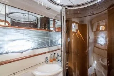 Slide: The Image of Luxurious bathroom interior of 2003 Viking Princess 65 yacht with modern fixtures. - 28