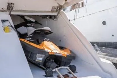 Slide: The Image of 2003 Viking Princess 65 yacht with a jet ski in storage compartment. - 3
