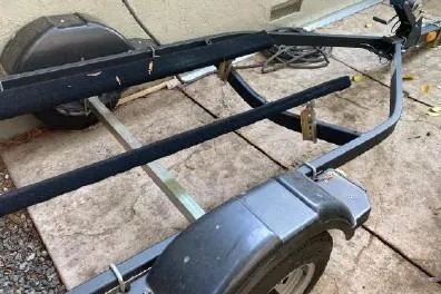 Slide: The Image of Boat trailer for 2003 Viking Princess 65, parked on a stone surface. - 30
