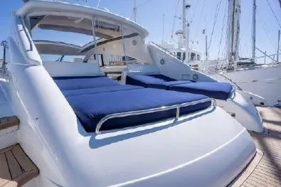 Slide: The Image of Luxury Viking Princess 65 yacht, 2003 model, featuring spacious sunbeds and sleek design. - 6