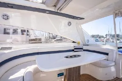 Slide: The Image of Luxurious 2003 Viking Princess 65 yacht interior with elegant seating and table. - 9