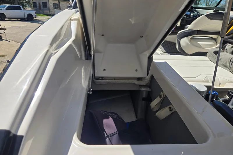 Slide: The Image of Open storage compartment in a 2014 Monterey 214SS Super Sport boat, showcasing interior space. - 15