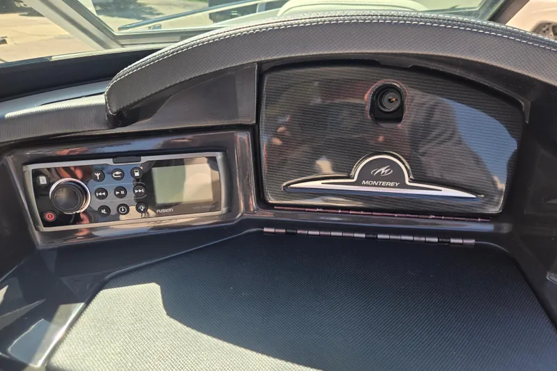 Slide: The Image of Dashboard of a 2014 Monterey 214SS Super Sport boat with audio controls. - 17