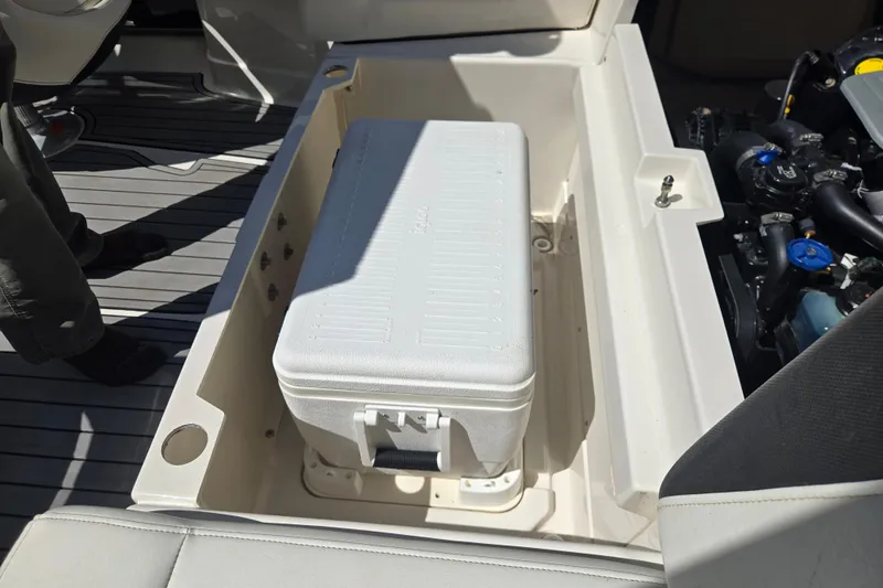 Slide: The Image of 2014 Monterey 214SS Super Sport boat interior with cooler storage compartment. - 18