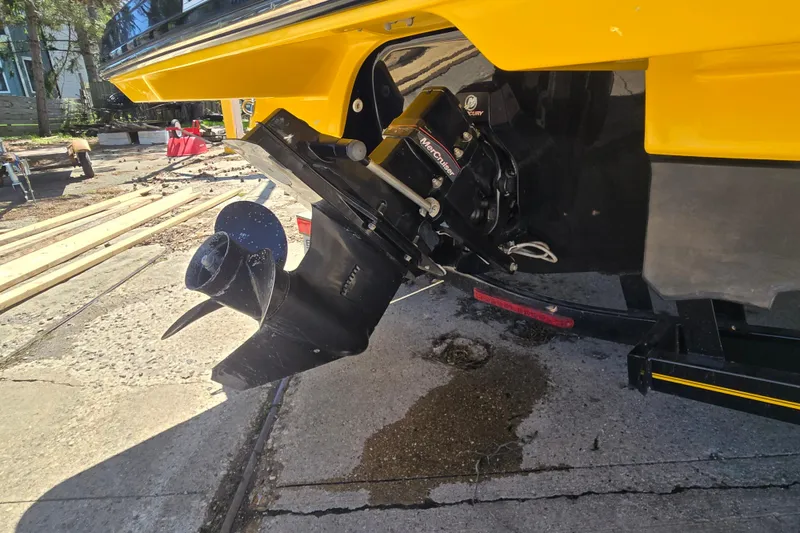 Slide: The Image of 2014 Monterey 214SS Super Sport boat with MerCruiser outdrive, parked on concrete. - 8