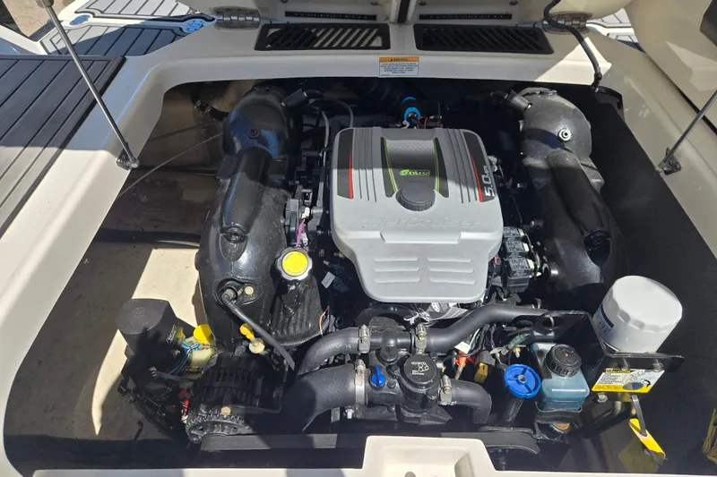 Slide: The Image of 2014 Monterey 214SS Super Sport engine compartment, showcasing a clean and well-maintained motor. - 9