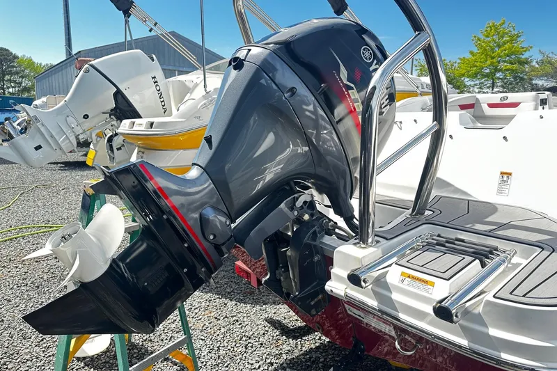 Slide: The Image of 2022 Godfrey Hurricane 185 SD boat with Yamaha outboard motor in a marina. - 12