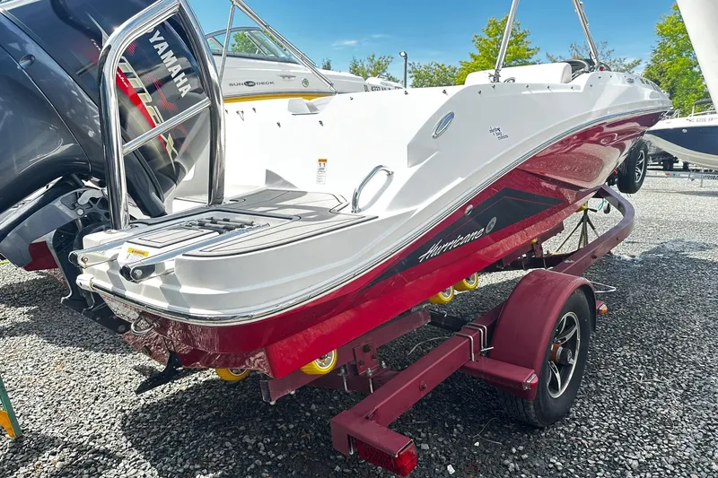 Slide: The Image of 2022 Godfrey Hurricane 185 SD boat on trailer, featuring Yamaha engine, parked outdoors. - 3