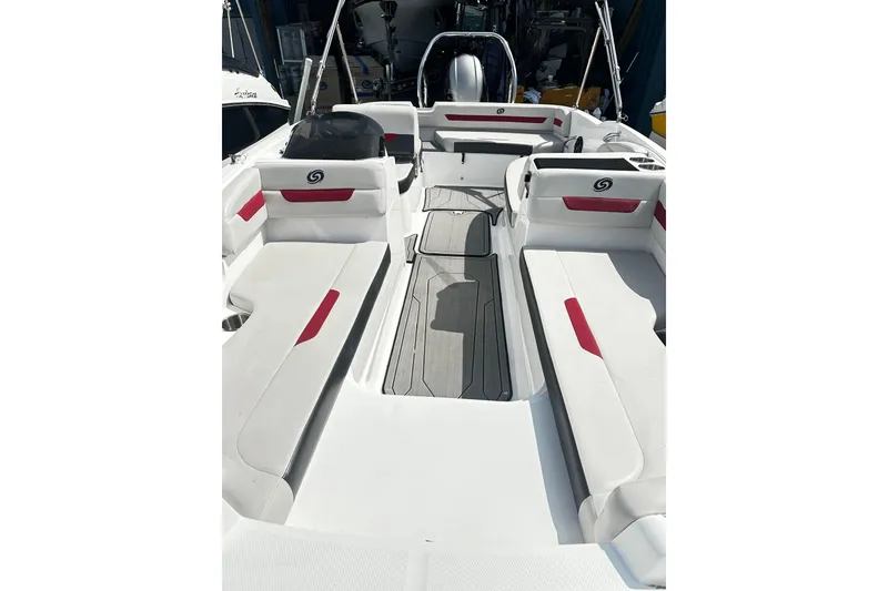 Slide: The Image of 2022 Godfrey Hurricane 185 SD boat interior with white and red seating, spacious layout. - 4