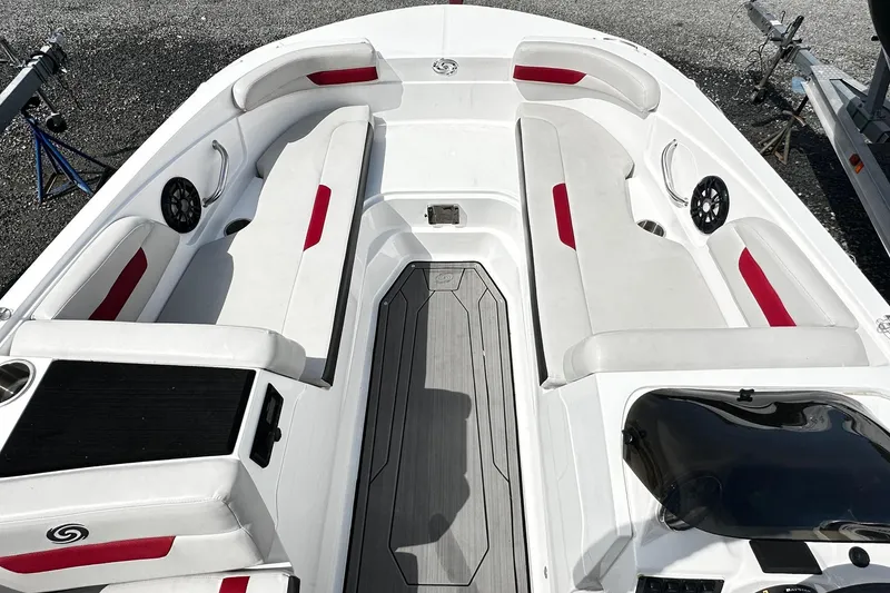 Slide: The Image of 2022 Godfrey Hurricane 185 SD boat interior with white and red seating, gray flooring. - 6