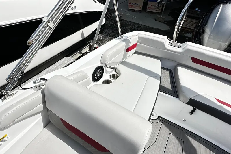Slide: The Image of Interior of a 2022 Godfrey Hurricane 185 SD boat with white and red seating. - 8
