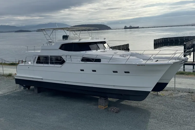 The Image of 2009 Northwest Powercats 58 yacht on land, with scenic waterfront background. - 0