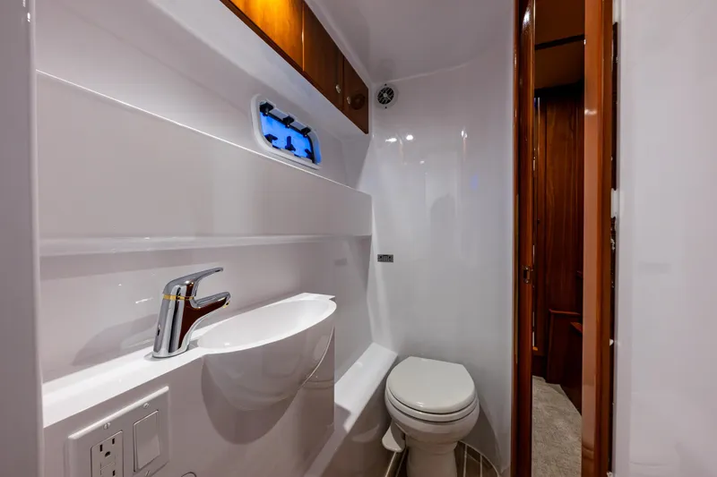 Slide: The Image of Luxurious bathroom in 2009 Northwest Powercats 58 yacht, featuring modern fixtures and sleek design. - 12