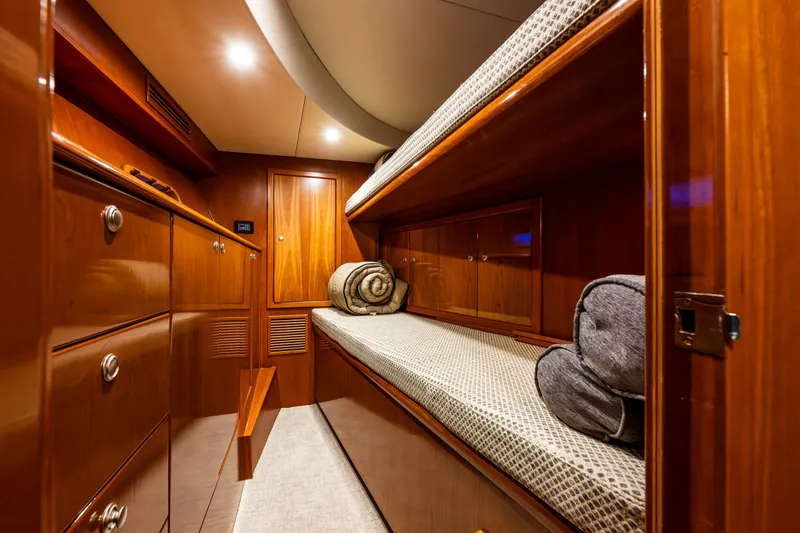 Slide: The Image of Luxurious wooden cabin interior of 2009 Northwest Powercats 58 yacht with cozy bunk beds. - 14