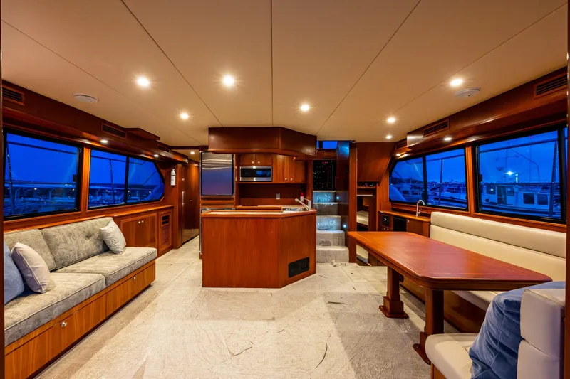 Slide: The Image of Luxurious interior of 2009 Northwest Powercats 58 yacht with elegant wood finishes and spacious seating. - 18