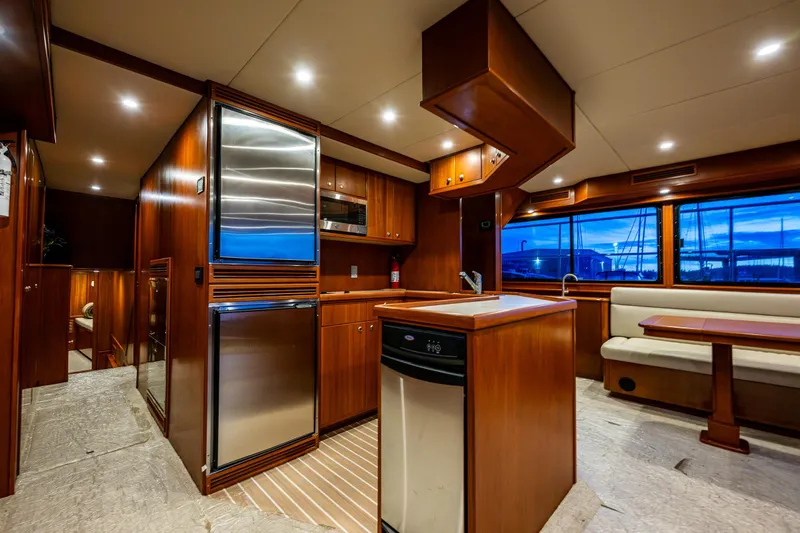 Slide: The Image of Luxurious 2009 Northwest Powercats 58 yacht interior with modern kitchen and dining area. - 21