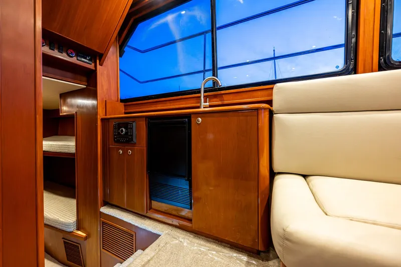 Slide: The Image of Luxurious interior of 2009 Northwest Powercats 58 yacht with wood cabinetry and seating. - 22