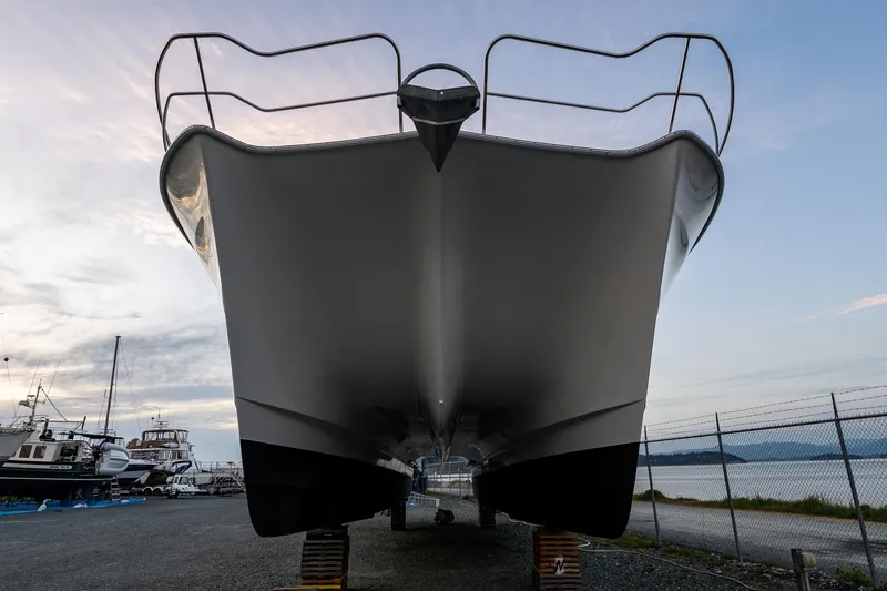 Slide: The Image of Front view of a 2009 Northwest Powercats 58 boat on dry dock. - 3