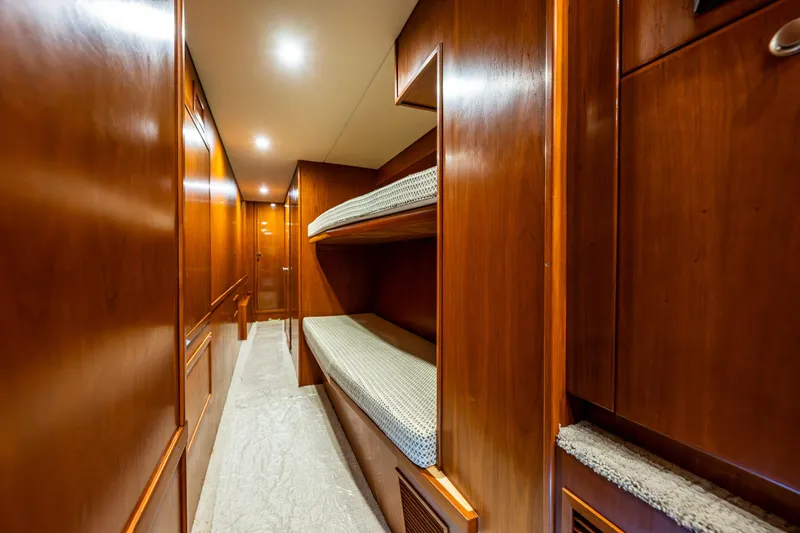 Slide: The Image of Interior of 2009 Northwest Powercats 58 yacht with wooden bunk beds and hallway. - 38