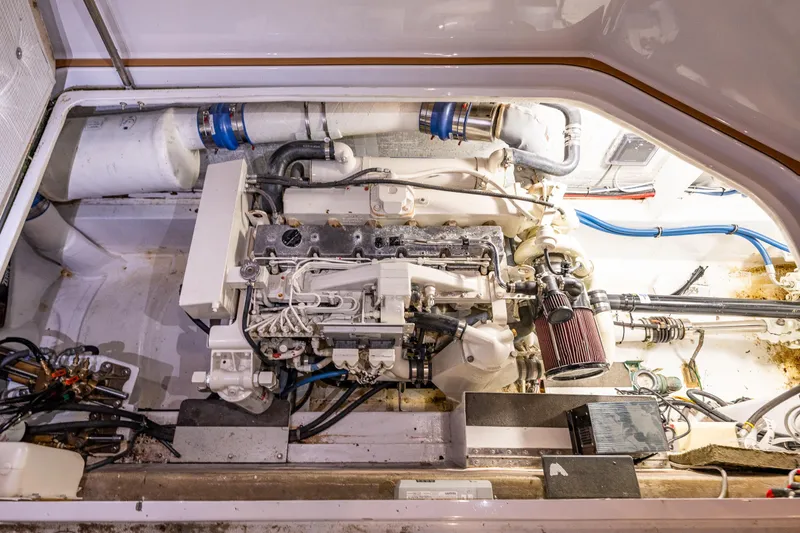 Slide: The Image of Engine compartment of a 2009 Northwest Powercats 58 boat, showcasing detailed machinery. - 39