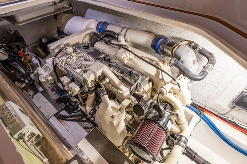 Slide: The Image of Engine room of a 2009 Northwest Powercats 58 boat, showcasing detailed machinery. - 40