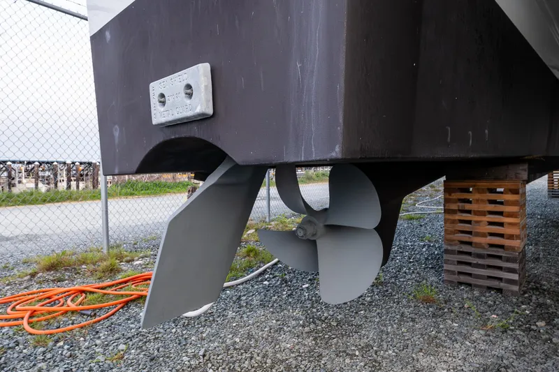 Slide: The Image of Propeller and rudder of 2009 Northwest Powercats 58 boat on dry dock. - 48